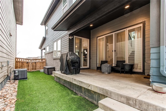 exterior space with a yard and central AC unit