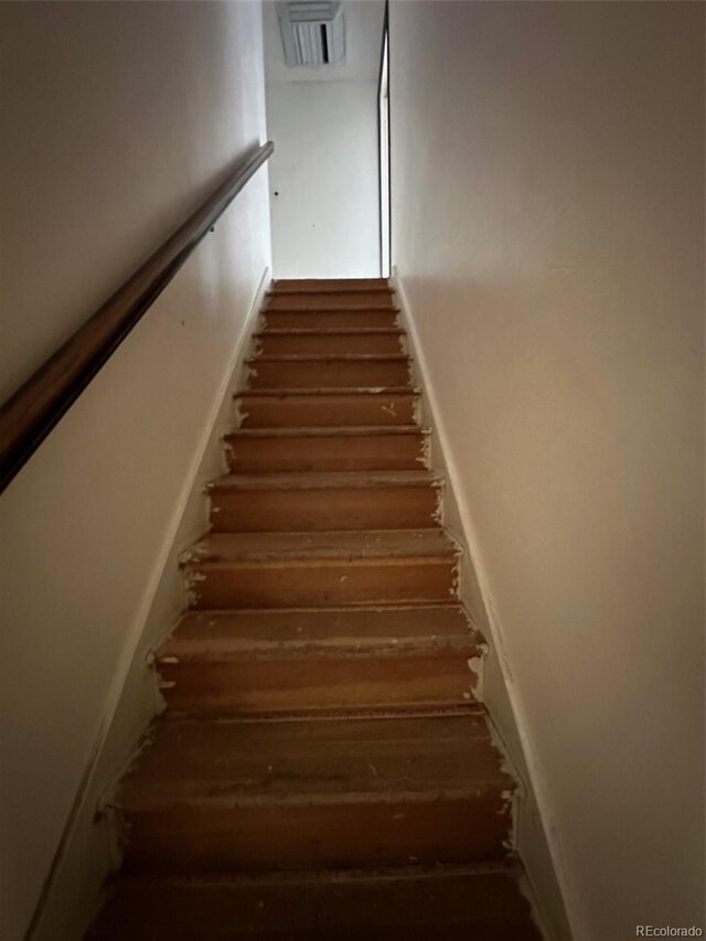 stairway with wood-type flooring