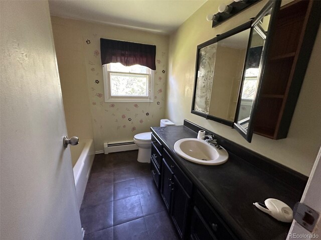 bathroom featuring a tub, vanity, tile patterned flooring, toilet, and a baseboard heating unit