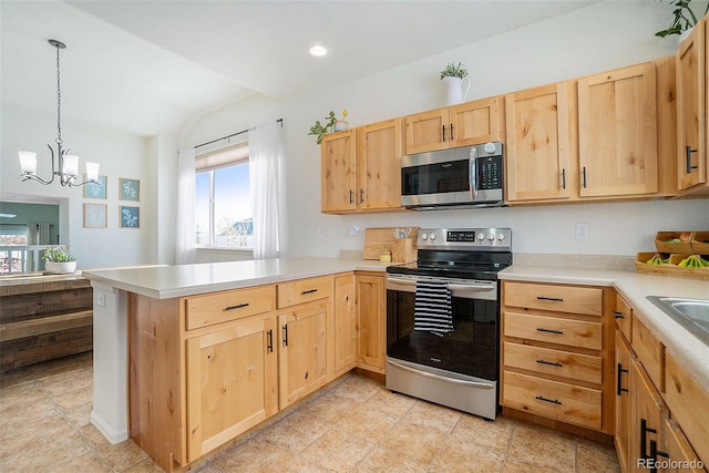 2137 Day Spring Dr, Windsor, CO 80550 - kitchen featuring appliances with stainless steel finishes, light brown cabinetry, a peninsula, lofted ceiling, and light countertops