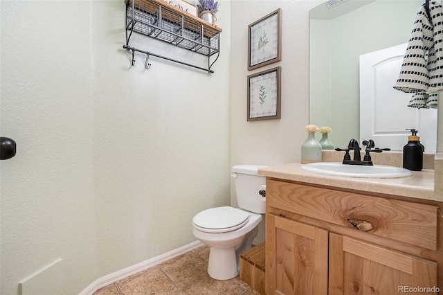 2137 Day Spring Dr, Windsor, CO 80550 - bathroom featuring toilet, vanity, tile patterned floors, and baseboards