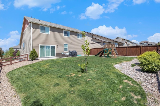 2137 Day Spring Dr, Windsor, CO 80550 - rear view of property with a playground
