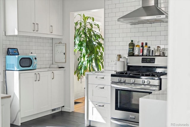 3384 W 29th Ave, Denver, CO 80211 - kitchen featuring gas range, wall chimney range hood, decorative backsplash, and light countertops