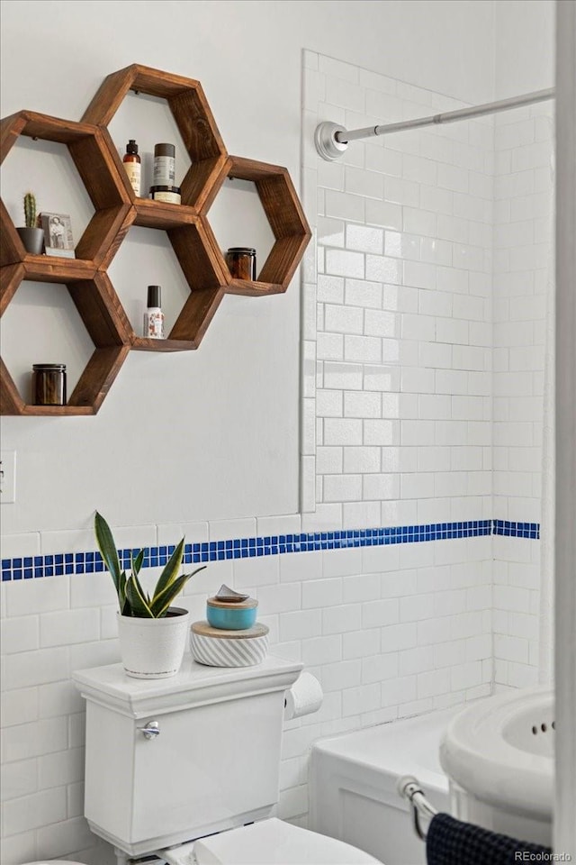 3384 W 29th Ave, Denver, CO 80211 - full bathroom featuring tile walls, toilet, a shower, and wainscoting