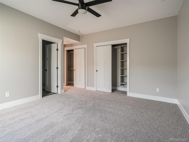 unfurnished bedroom featuring ceiling fan and carpet floors