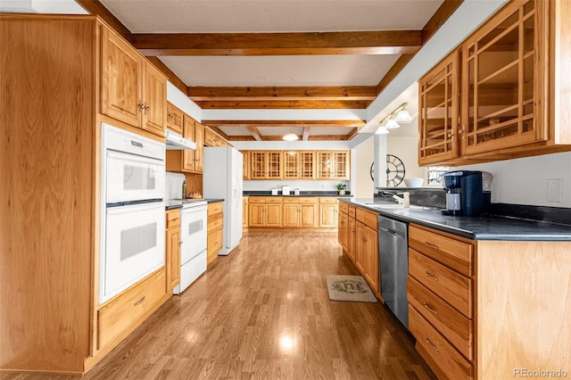 2706 Penacho Cir, Colorado Springs, CO 80917 - kitchen with white appliances, wood finished floors, dark countertops, beam ceiling, and glass insert cabinets