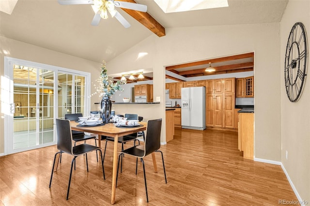2706 Penacho Cir, Colorado Springs, CO 80917 - dining room featuring a skylight, light wood-style flooring, ceiling fan, and baseboards