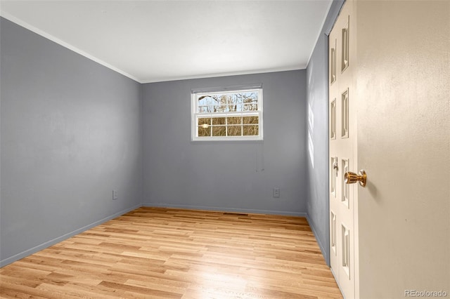 2706 Penacho Cir, Colorado Springs, CO 80917 - empty room featuring light wood-style flooring, ornamental molding, and baseboards