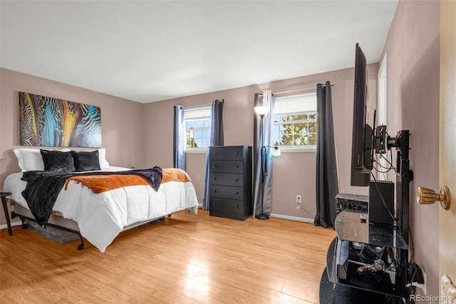 2706 Penacho Cir, Colorado Springs, CO 80917 - bedroom featuring light wood-type flooring and baseboards