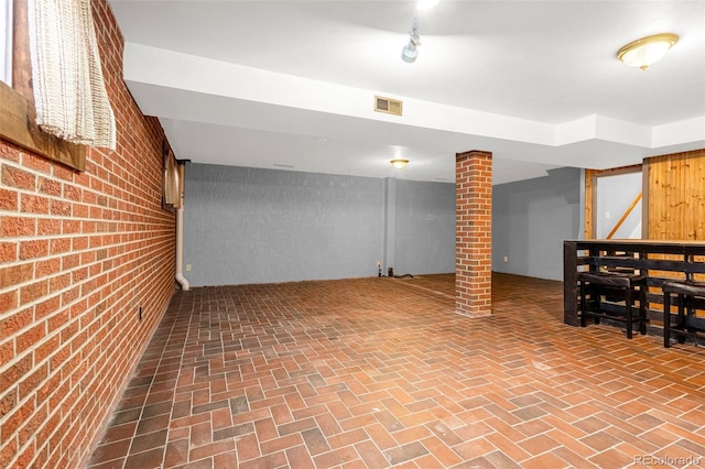 2706 Penacho Cir, Colorado Springs, CO 80917 - finished below grade area with brick wall and brick patterned floors