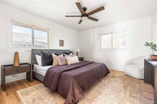 13416 W 22nd Pl, Golden, CO 80401 - bedroom with baseboards, ceiling fan, and light wood-type flooring