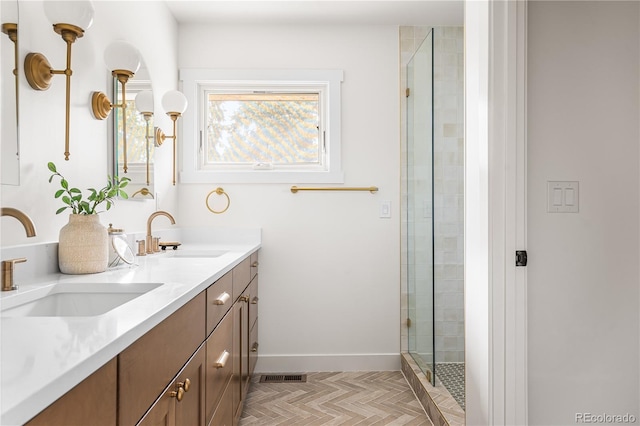 13416 W 22nd Pl, Golden, CO 80401 - bathroom with a sink, a tile shower, double vanity, and visible vents