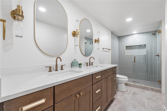 13416 W 22nd Pl, Golden, CO 80401 - bathroom with double vanity, toilet, a shower stall, and a sink