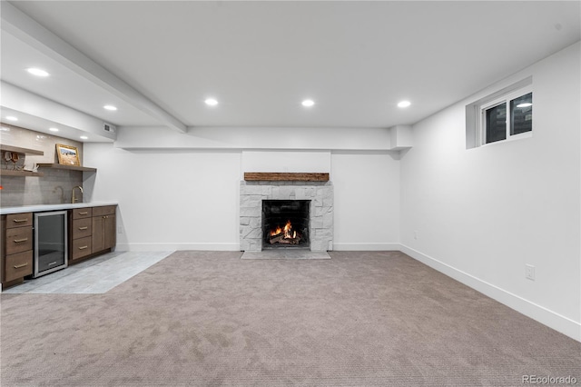 13416 W 22nd Pl, Golden, CO 80401 - unfurnished living room with light carpet, a fireplace, indoor wet bar, recessed lighting, and wine cooler