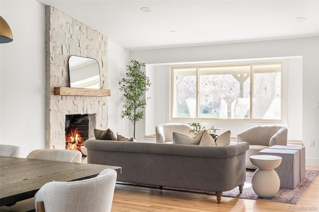 13416 W 22nd Pl, Golden, CO 80401 - living area featuring a stone fireplace and wood finished floors