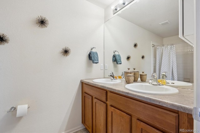 bathroom with a shower with curtain and vanity