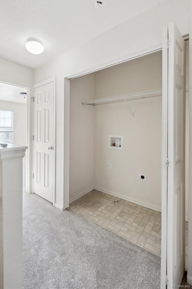 clothes washing area featuring hookup for an electric dryer, light carpet, and washer hookup