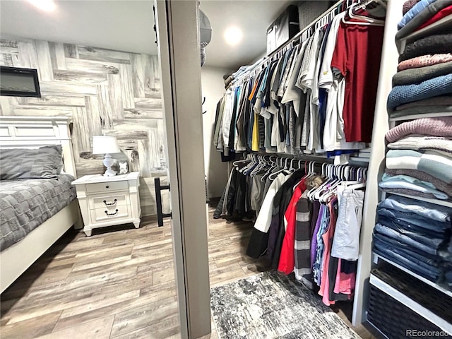 spacious closet with wood finished floors