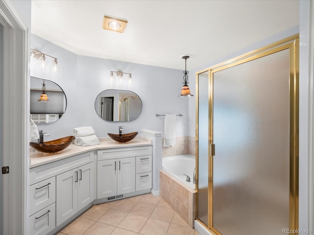 full bath with a sink, a bath, tile patterned floors, and a shower stall