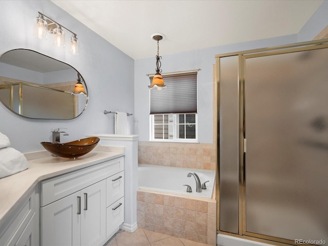 bathroom with vanity, tile patterned flooring, a bath, and a stall shower