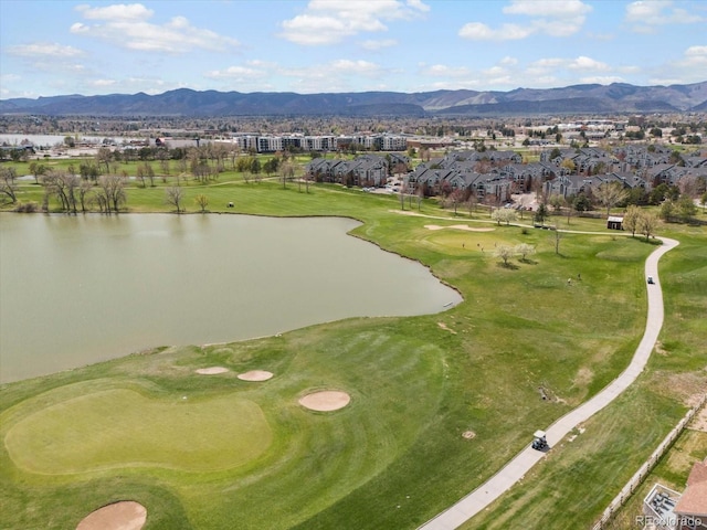aerial view featuring a residential view, a water and mountain view, and golf course view