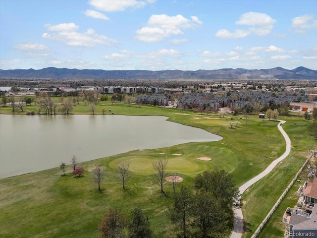 bird's eye view with a water and mountain view, view of golf course, and a residential view