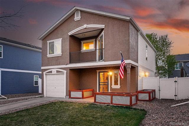 4705 Andes St, Denver, CO 80249 - view of front of house featuring a balcony, a gate, stucco siding, and an attached garage