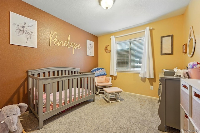 4705 Andes St, Denver, CO 80249 - carpeted bedroom with a crib, a textured wall, and baseboards