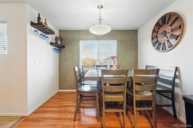 4705 Andes St, Denver, CO 80249 - dining room with light wood finished floors and baseboards