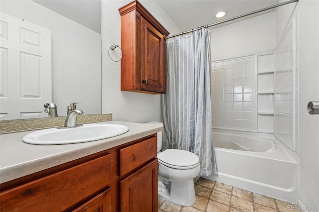 4705 Andes St, Denver, CO 80249 - bathroom with stone tile flooring, toilet, vanity, and shower / tub combo with curtain