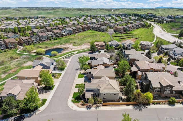 aerial perspective of suburban area with a large body of water