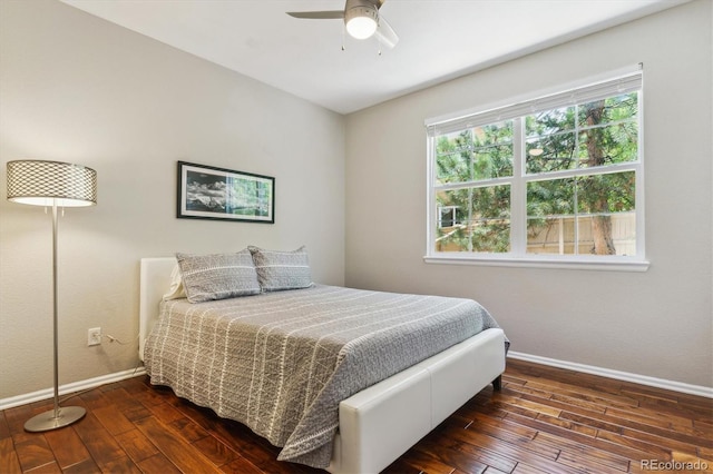 bedroom with hardwood / wood-style floors, baseboards, and ceiling fan