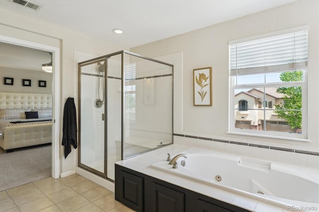 bathroom featuring ensuite bath, a shower stall, a whirlpool tub, and tile patterned flooring