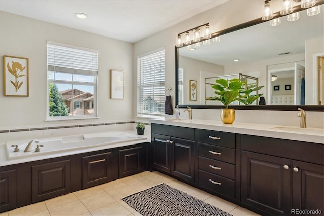 bathroom with tile patterned floors, a bath, double vanity, and a shower stall