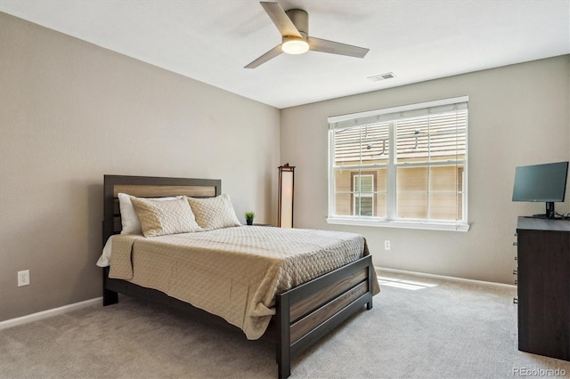 bedroom featuring carpet floors, baseboards, and ceiling fan