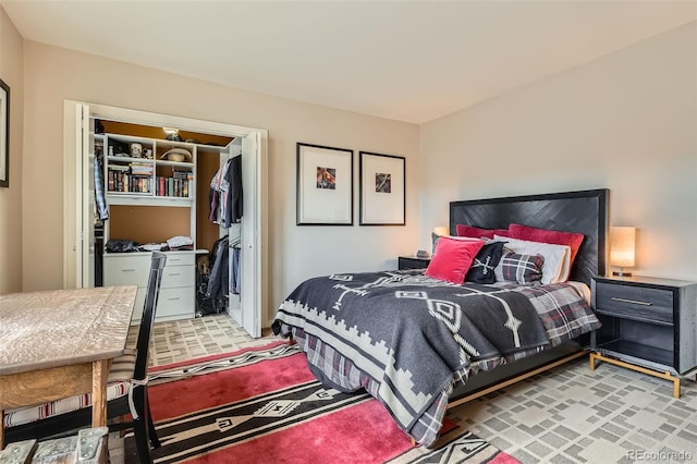 bedroom featuring a closet and a walk in closet