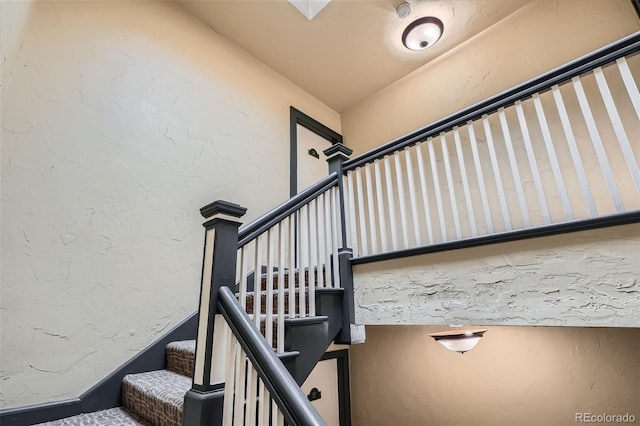 stairway with a textured wall