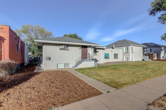 2275 S Cherokee St, Denver, CO 80223 - view of front of house with brick siding and a front lawn