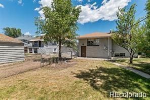 2275 S Cherokee St, Denver, CO 80223 - view of front of home featuring a front lawn
