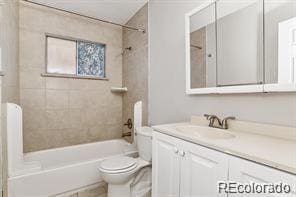 2275 S Cherokee St, Denver, CO 80223 - bathroom featuring vanity, toilet, and shower / bathtub combination