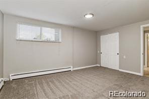 2275 S Cherokee St, Denver, CO 80223 - below grade area featuring baseboard heating and baseboards