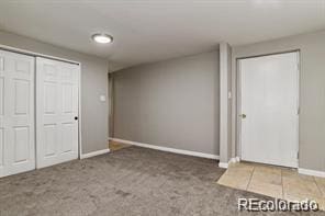 basement with dark colored carpet