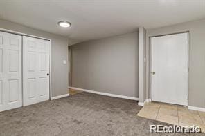 2275 S Cherokee St, Denver, CO 80223 - unfurnished bedroom featuring baseboards, carpet floors, and a closet