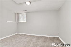 unfurnished room with carpet floors