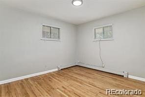 empty room featuring wood-type flooring