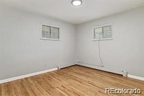2275 S Cherokee St, Denver, CO 80223 - empty room with baseboards and wood finished floors