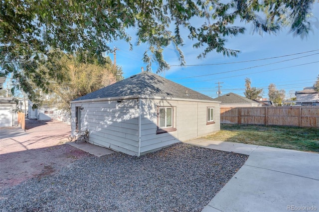 2275 S Cherokee St, Denver, CO 80223 - back of property featuring roof with shingles