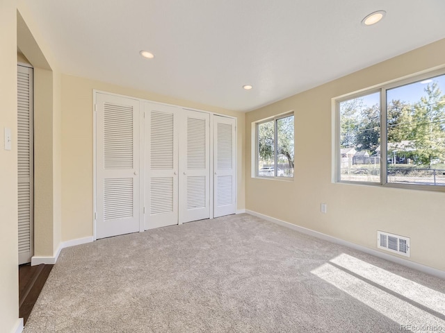 unfurnished bedroom with carpet floors