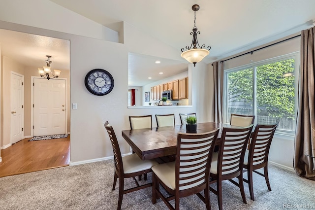2556 E 131st Pl, Thornton, CO 80241 - dining area featuring light carpet, a chandelier, lofted ceiling, baseboards, and recessed lighting