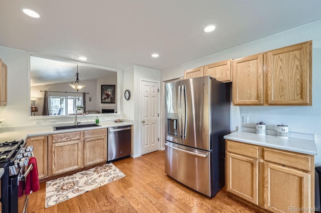 2556 E 131st Pl, Thornton, CO 80241 - kitchen with stainless steel appliances, a sink, light brown cabinetry, light countertops, and recessed lighting